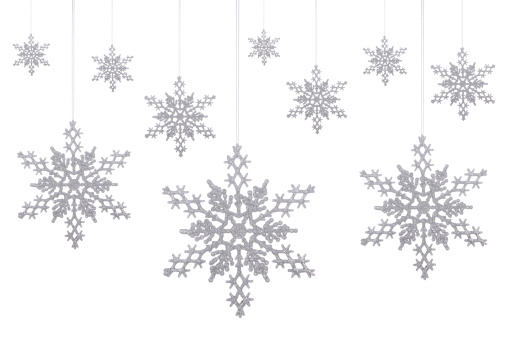 New 2012 Silver glitter snowflakes hanging on a white background.PLEASE CLICK ON THE IMAGE BELOW TO SEE MY CHRISTMAS LIGHTBOX: