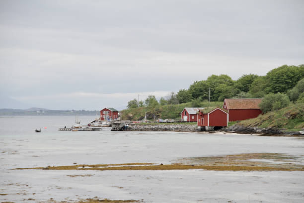istock Red wooden cottages on waterside Norway 171309725