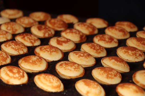 Traditional Dutch Poffertjes, cereal pancakes stock photo