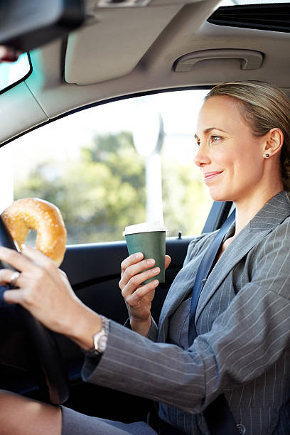 istock Female Professional Holding Bagel And Coffee Cup 171310433