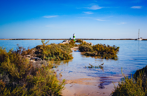 Entrance to Fuseta harbor in high tide in ria formosa nature park
