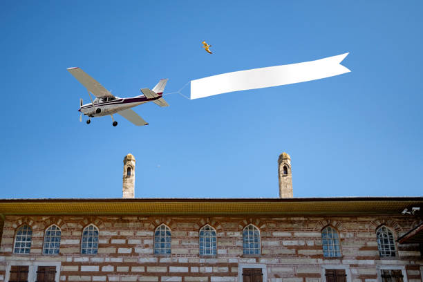 Airplane with banner in day