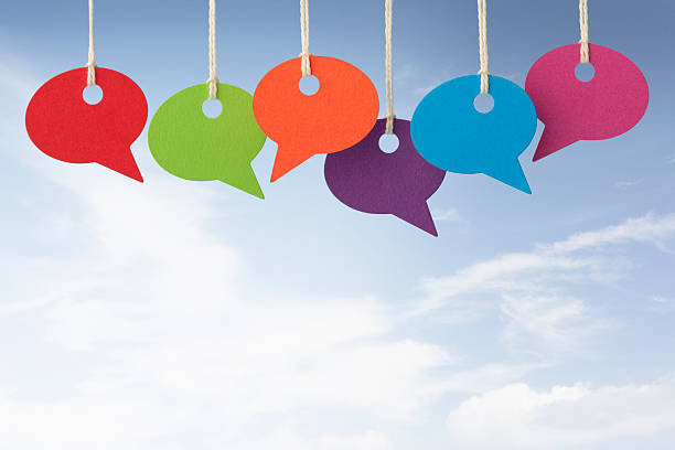 istock Six colourful speech bubbles against blue sky 171311004