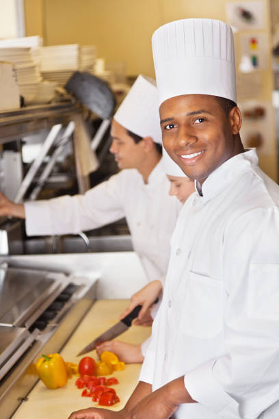 istock Happy chef preparing food in a restaurant commercial kitchen 171311007