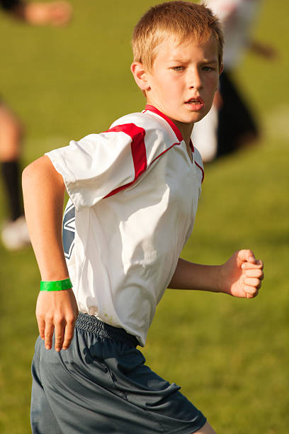 istock Young Boy Soccer Player Concentrating on the Ball 171311302
