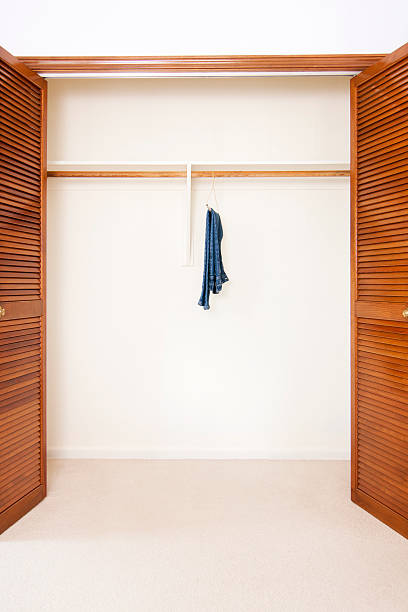 Single pair of jeans hanging in closet.  Concept for having nothing to wear