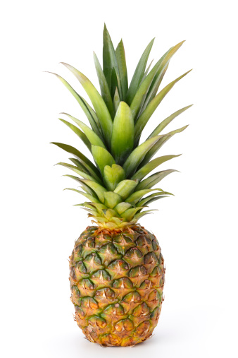 A whole pineapple isolated on a white background.