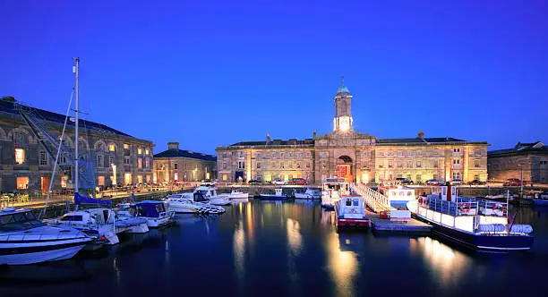 A low light night scene of the Royal William yard harbour. This is a nearly developed part of Plymouth which host a number of restraints and a leisure harbour. A popular place for visitors to the city.The picture was captured at night which a long exposure creating some movement in the water and boats.More photographs from Plymouth in my portfolio here -