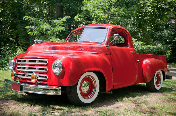 An old red pickup farm truck from the 1950's. All logos removed.
