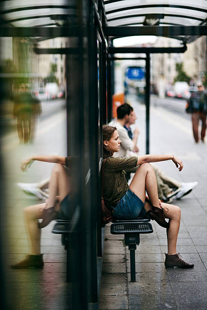 istock Young woman on bus stop 171313294