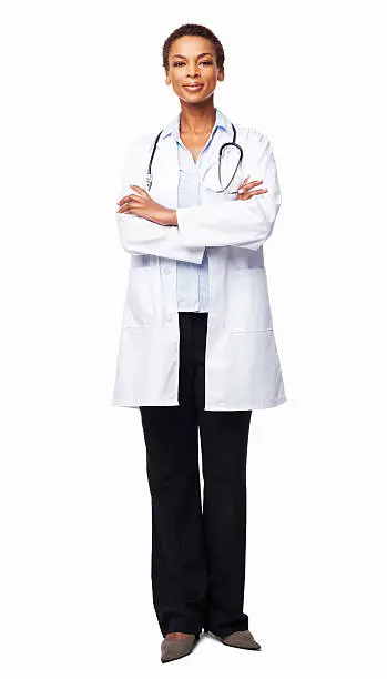 Full length portrait of a confident African American female doctor standing with arms crossed. Vertical shot. Isolated on white.