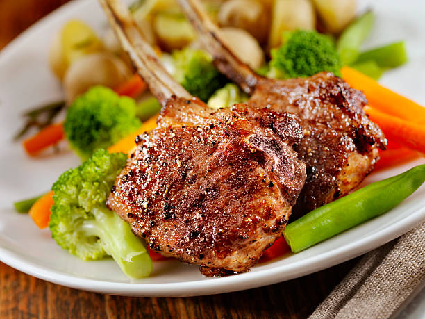 Braised Lamb Chops Braised Lamb Chops with Steamed Vegetables and Rosemary Potatoes- Photographed on Hasselblad H3D2-39mb Camera braised stock pictures, royalty-free photos & images