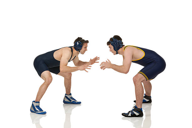 Muscular competitive man, boxing, mma athletes with drawn head of ancient man fighting over yellow background. Contemporary art collage. Concept of sport, tournament, competition, ancient Greek style
