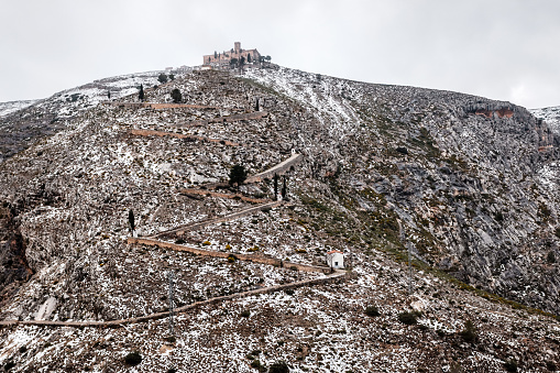 View of the Hermitage of Santo Cristo on the snow-capped mountain of Calvary in the city of Bocairent.