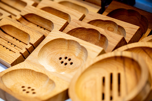 Various wooden soap dishes with drain holes and in different shapes