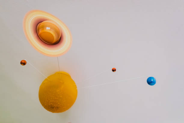 istock Toy planets high on the ceiling of a room. 1713145739