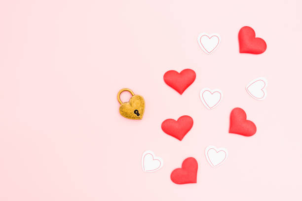 istock Pink background with romantic heart-shaped padlock, chained love concept. 1713150672