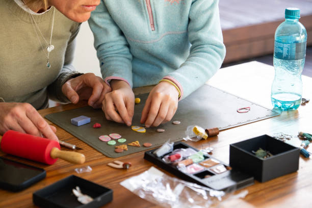 istock Young girl making some jewelry 1713152882