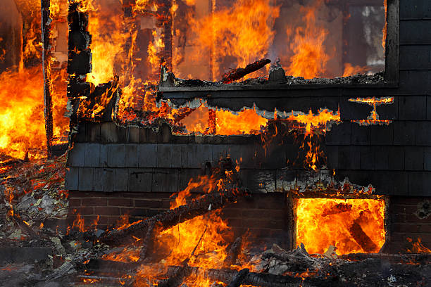 istock Charred and dark sinister house fire. 171315450