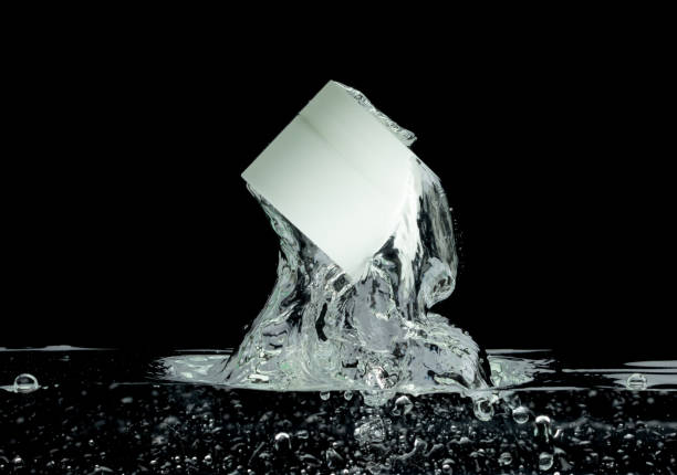 istock Cosmetic container fall into clear water with air bubble. Small cosmetic treatment container drop to clear water of freshness. Black background isolated freeze element 1713159046