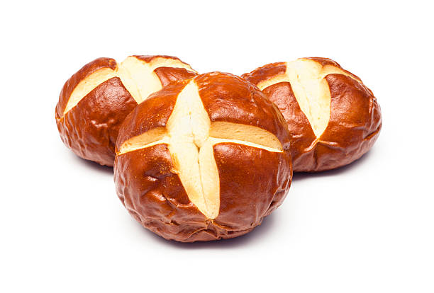 Pretzel Bread "Mini-loaves with a deep, brown pretzel crust and a slightly sweet, tender center." bun stock pictures, royalty-free photos & images