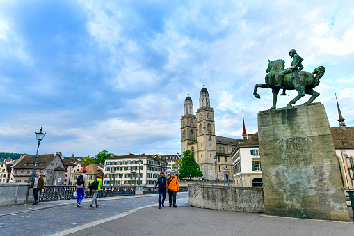 Zurich - May 15 ,2023 :Scenic evenning view of historic Zurich city center with Grossmunster Church ,Switzerland