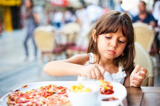 istock Little Girl Enjoying her Meal 171317691