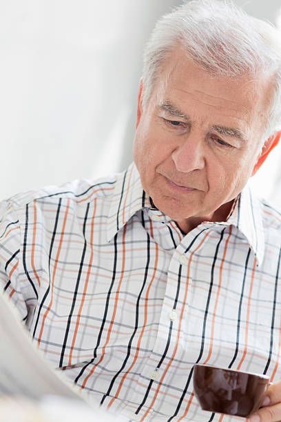 istock Senior man reading his morning paper 171317736