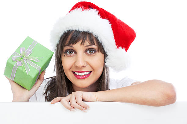 istock Young woman with santa hat and christmas gift 171317819