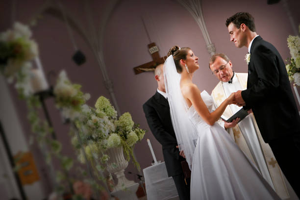 Bride and groom at the alter during their wedding ceremony in an old church.