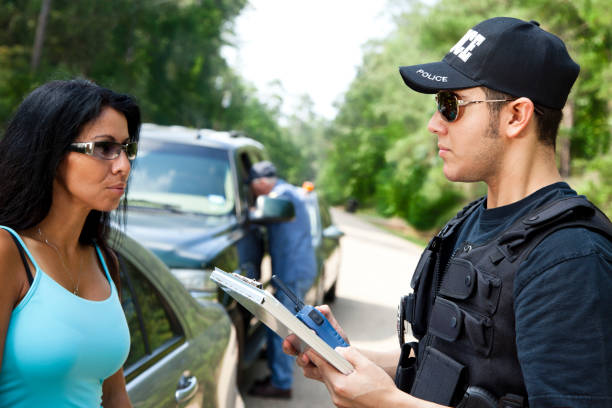 istock Policeman talking with woman during traffic stop 171318219