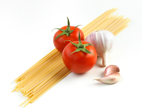 pasta,tomato and garlic on white background 