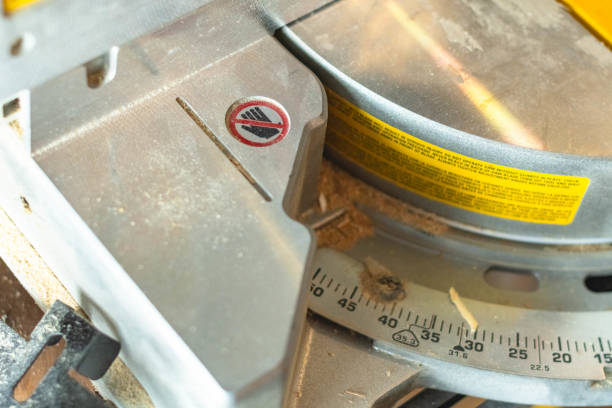 Close up of miter saw focus on danger safety symbol sign stock photo