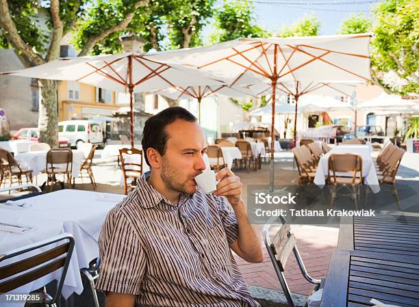 Man Drinking Espresso Stock Photo - Download Image Now - Village, Town Square, Cafe