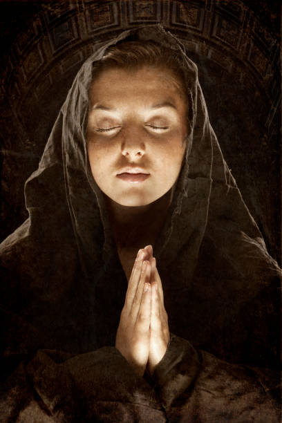 istock young woman with hoody and folded hands thinking 171319409
