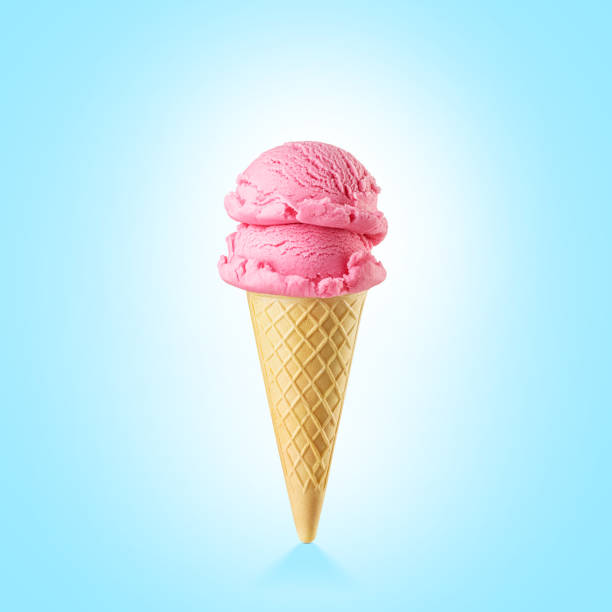 istock Two pink strawberry ice cream scoops served on a waffle cone on blue background. 1713194281