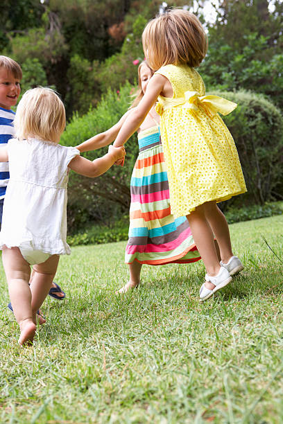 istock Group Of Children Playing Outdoors Together 171319569