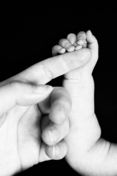 istock Newborn Hand Holding Mom's Finger 171319573