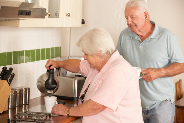 istock Retired Senior Couple In Kitchen Making Hot Drink 171320150