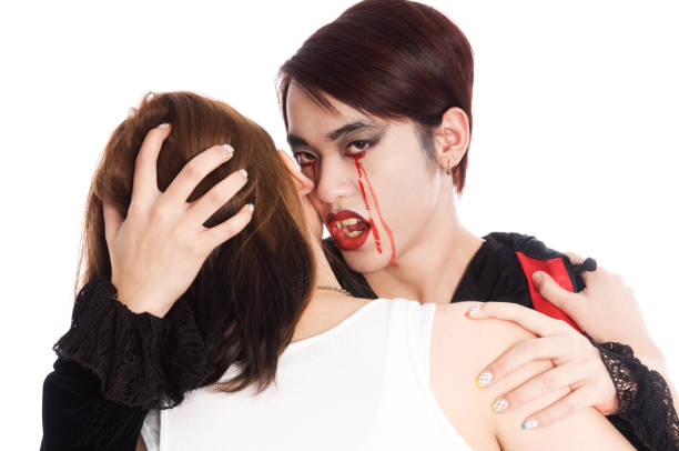 istock Crying vampire about to bite young woman. 171320269
