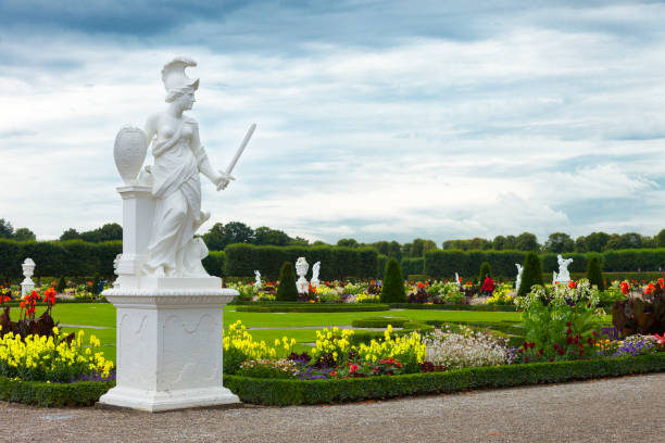 Herrenhausen Gardens "Hannover, Germany. August 5, 2012: The Great Garden of Herrenhausen Gardens, is unique garden grounds, laid out in a baroque style, are one of the most famous attractions in Hannover. These were sculpted in 1699 on the request of princess Sophie. Pictured are some of the many tourists visiting the place that day." knot garden stock pictures, royalty-free photos & images