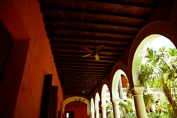 istock colonial architecture: wooden beams in lush courtyard 171320474