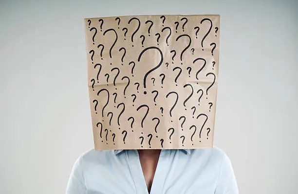 woman wearing a paper bag with questions mark