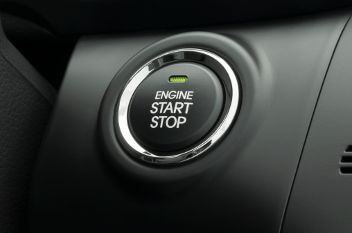 Keyless smart key engine start/stop button on a modern vehicle.