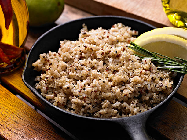 Quinoa Quinoa with Brown Rice in a Cast Iron Pan. quinoa photos stock pictures, royalty-free photos & images