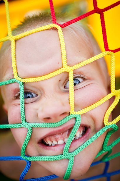 Crazy kid in bounce house stock photo