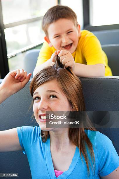 Boy Pulling Girls Hair On The School Bus Stock Photo - Download Image Now -  Boys, Brat, Bus - iStock