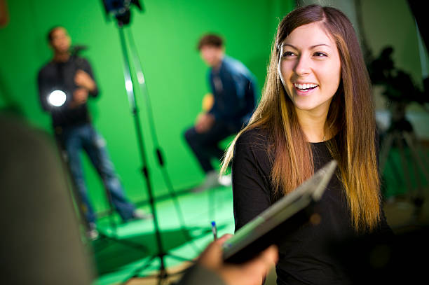 media student in the studio media student in college tv studio television camera photos stock pictures, royalty-free photos & images