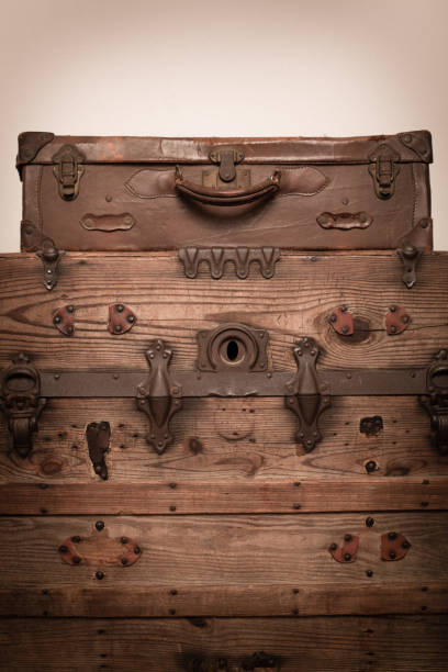 istock Retro Brown Suitcase Sitting on Old, Wood Trunk 171321773