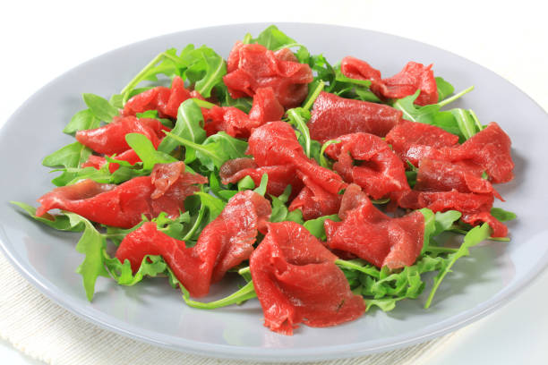 Carpaccio with arugula on a plate
